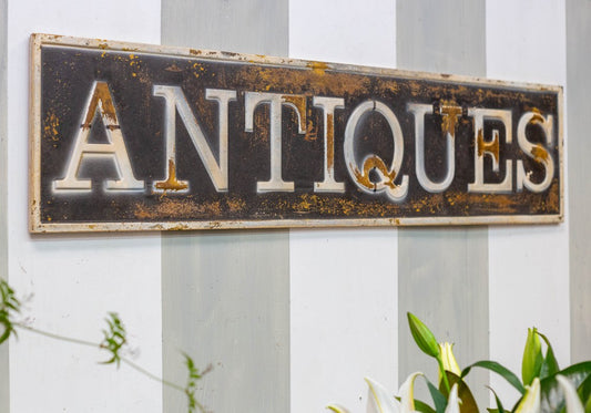 Metal ANTIQUES sign